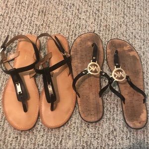 2 black sandals with gold accents